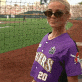a woman wearing a purple jersey that says gers 20