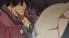 a man in a red jacket has the number 1 on his sleeve