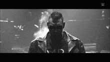 a black and white photo of a man wearing sunglasses