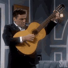 Playing A Guitar Oscar Isaac GIF - Playing A Guitar Oscar Isaac Saturday Night Live GIFs