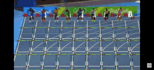 a group of runners on a track with rio 2016 written on the wall behind them