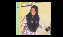 a woman wearing a black head scarf and a white and black shirt