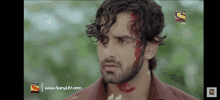 a man with blood on his face is on a sony channel