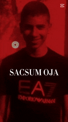 a man wearing an emporio armani t-shirt is smiling