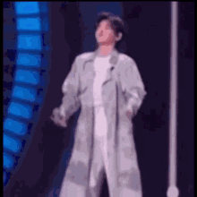 a blurry picture of a person standing on a stage