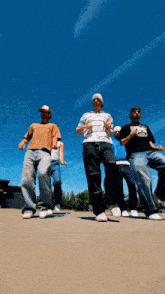 a group of young men are dancing on a street with one wearing a shirt that says ' snoop dogg ' on it
