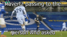 a soccer player has the number 29 on his jersey and is passing to the person who asked