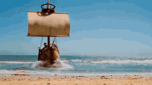 a boat with a sail is coming into the ocean