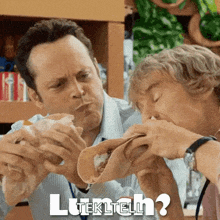 two men are eating tacos with the words lunch written in white