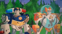 a couple of cartoon robots standing next to each other with one of them covered in mud