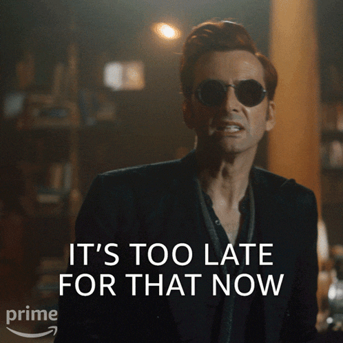 a man wearing sunglasses and a suit says 