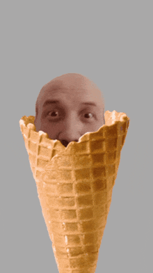 a bald man with a mustache is in a waffle cone