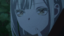 a close up of a girl 's face with a shadow behind her