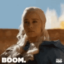 a close up of a woman 's face with the word boom on it
