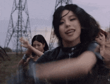 a group of young women are dancing in a field