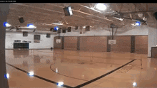 a basketball court with the time of 15:15 pm on the bottom