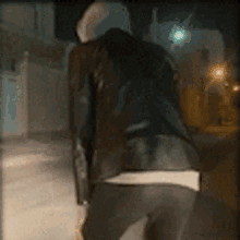 a blurred image of a person walking down a street