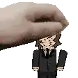 a cartoon character in a suit and tie is being held by a hand .