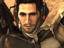 a close up of a man wearing a helmet with a sticker on it that says ' armour ' on it