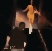 a blurred image of a woman in a yellow dress with the number 100 on the bottom right