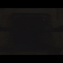 darth vader is holding a light saber in the dark