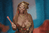 a woman holding a fan in front of a blue background that says zeus on it