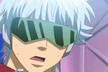 a close up of a person wearing a pair of sunglasses