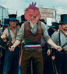 a man with a bear mask on his head stands in front of a sign that says hardware