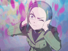 a girl covering her ears with her hands while making a funny face