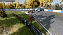 a stop sign on the side of a race track