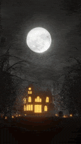 a halloween greeting card with a haunted house and bats