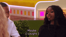 a woman says maybe laughs while sitting in front of a man