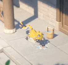 a cartoon character is laying on the ground next to a bucket .