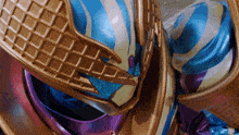 a close up of a blue and purple costume