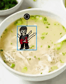 a bowl of soup with a drawing of a man with a guitar