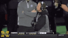 a football game between michigan and nwestern is being played on espn