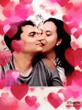 a picture of a man and woman kissing surrounded by hearts