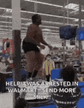 a man is jumping over a bar in a walmart .