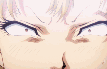 a close up of a woman 's face with a very angry look on her face