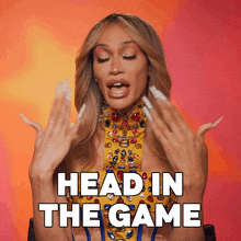 a woman says head in the game with her hands up in the air