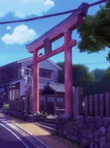a red gate with chinese writing on it