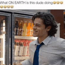 a man is smiling in front of a fridge that says what on earth