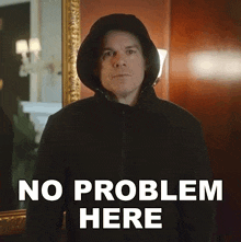 a man in a hooded jacket is standing in front of a mirror and says " no problem here "