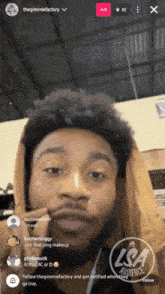 a man 's face is shown on a live stream with lsa audience written in the corner
