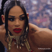 a close up of a woman 's face with tiffanyluv24 written on the bottom right
