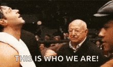 two men are standing next to each other in a boxing ring and one of them is saying `` this is who we are '' .