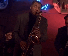 James Earl Jones Saxophone GIF - James Earl Jones Saxophone Chuckle GIFs