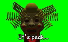 a green screen shows a clown and the words it 's peak