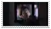 a person is sitting in front of a television screen .