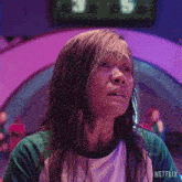 a woman with wet hair is wearing a green and white shirt that says netflix